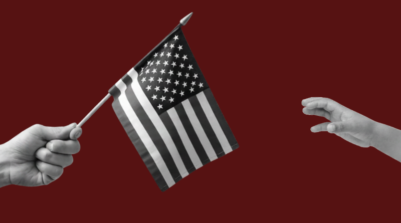 Person holding a flag and a person reaching for a flag.
